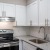 a kitchen with white cabinets